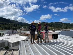 Women leading the installation of the mircogrids PV panels