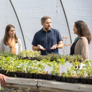 Faculty talk in greenhouse