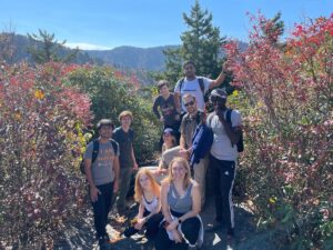 students hiking in the mountains for American cultural experience