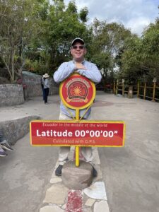 Will Jennings posing at the equator in Ecuador
